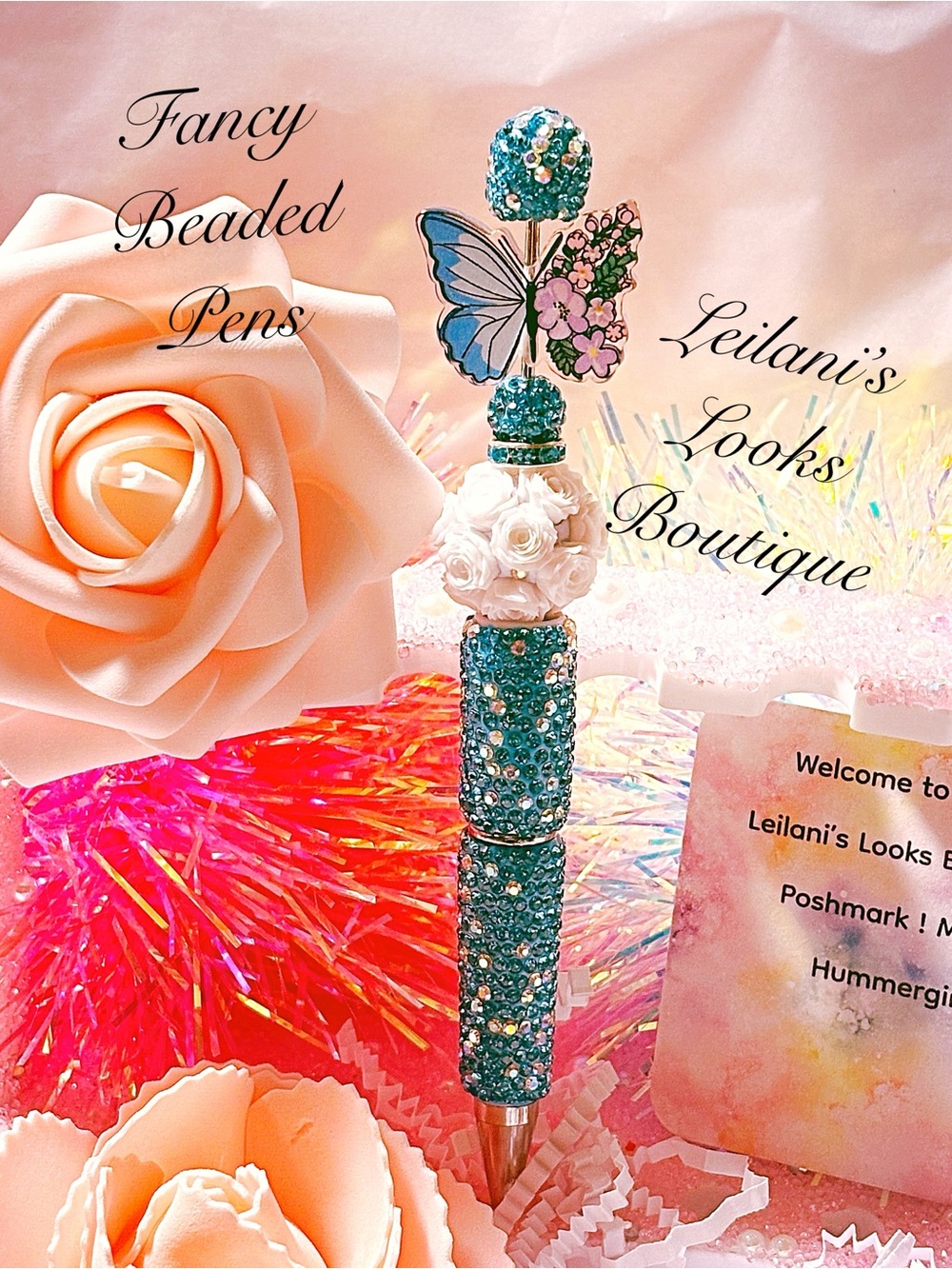 Blue butterfly pen with rhinestones and floral embellishments